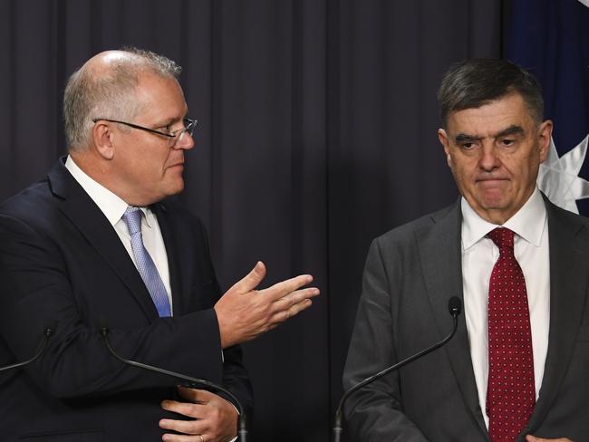 Australian Prime Minister Scott Morrison (left) and Australia's Chief Medical Officer Professor Brendan Murphy speak to the media during a press conference at Parliament House in Canberra, Thursday, March 5, 2020. (AAP Image/Lukas Coch) NO ARCHIVING