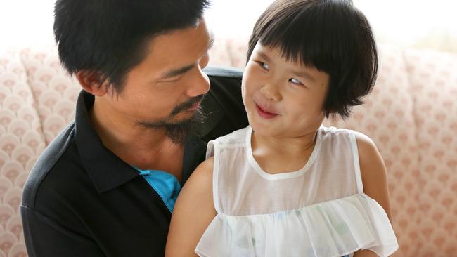 Shu Lee reads to daughter Esther. Picture: Angelo Velardo