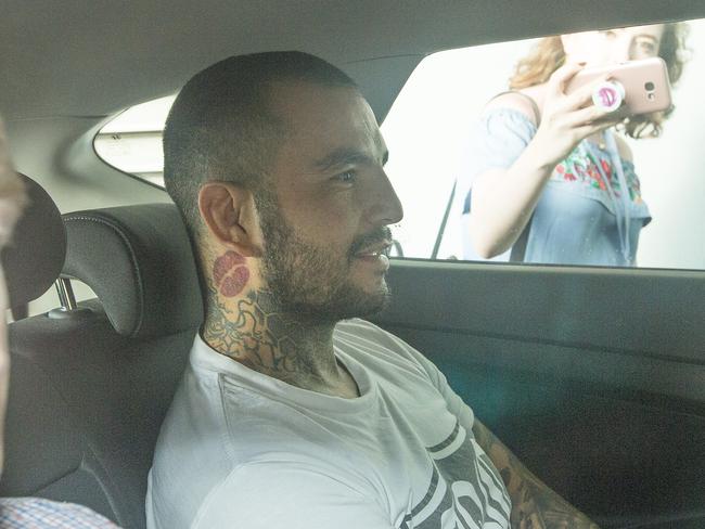 Bikie and MMA fighter Gokhan Turkyilmaz being brought into the Southport Watchhouse. Picture: Jerad Williams.