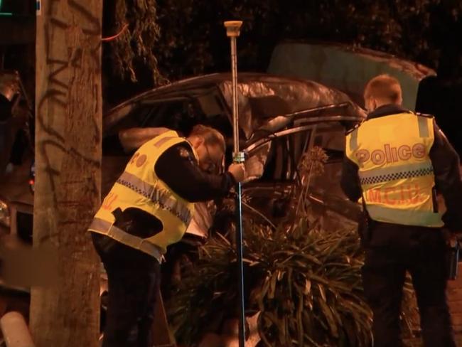 Police inspect the wreckage of the crash. Picture: 9 News