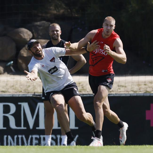 Essendon assistant coach Travis Cloke, left, played his first match for Nullawil on Saturday. Pic: Michael Klein