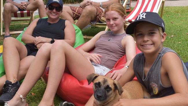 (L-R) Jodie, Neave and Finn Osbourne with Dixie the dog at day two of the Senior and Masters division of the 2023 Queensland Surf Life Saving Championships at Mooloolaba. Photo: Elizabeth Neil