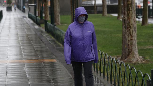 The rainfall quickly blanketed the city in the early afternoon. Picture: NCA NewsWire / David Crosling