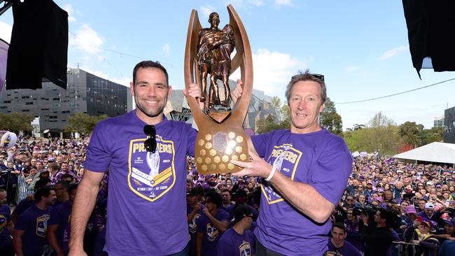 Storm captain Cameron Smith and coach Craig Bellamy hold up the trophy at Federation Square in 2017. Picture: AAP Image/Mal Fairclough