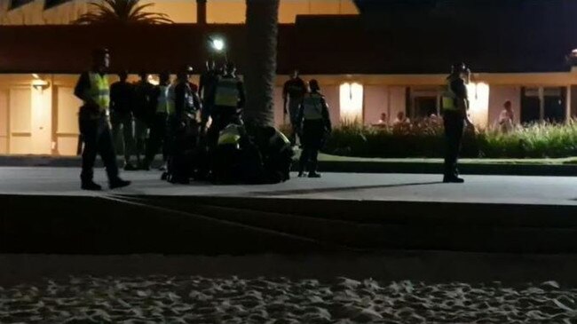 Police on the St Kilda foreshore last night. Picture: Channel 9