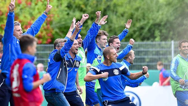 Members of the Astoria Walldorf bench celebrate the historic victory.