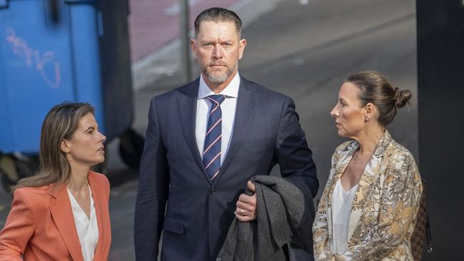 Oliver Shultz, an Australian soldier accused of murder while on duty in Afghanistan, arrives at Downing Centre court with lawyer Karen Espiner and his wife. Picture: NewsWire / Simon Bullard