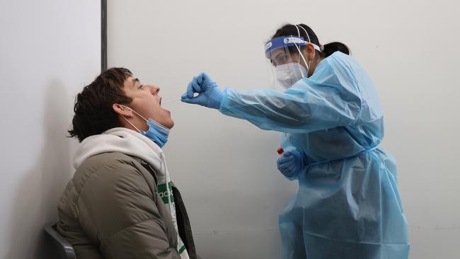 ADELAIDE, AUSTRALIA - NewsWire Photos July 27 2022: Peter Hennell is given a PCR test by nurse Harman Deep in the new Kilkenny clinic. South Australian Health Minister Chris Picton has opened a new respiratory clinic in Kilkenny, Adelaide. NCA NewsWire / David Mariuz