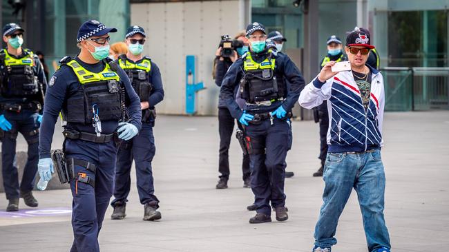 An anti-vaxx protester outside Melbourne Exhibition Building vaccination hub in June. Picture: Jake Nowakowski