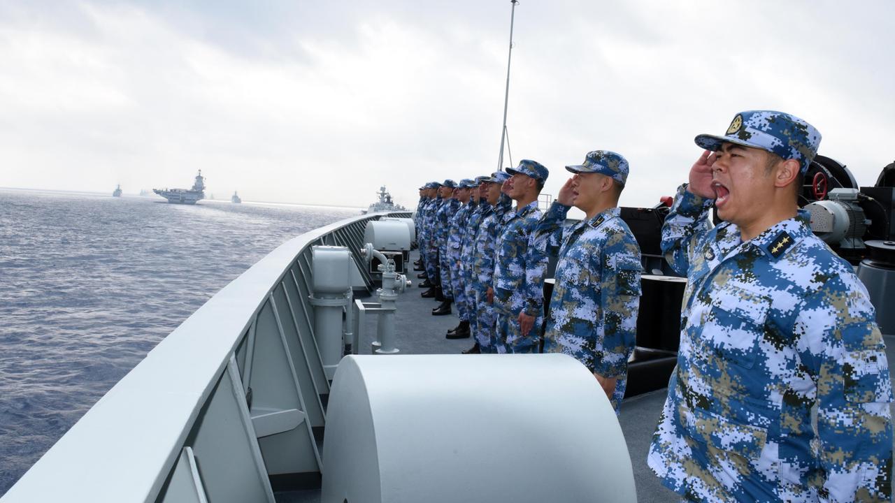 A PLA Navy fleet including the aircraft carrier Liaoning, submarines, vessels and fighter jets take part in a review in the South China Sea on April 12, 2018. Picture: VCG/VCG via Getty Images.