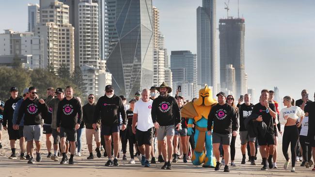 Former NRL star Chris Walker finishes his walk from Cairns to the Gold Coast at Kurrawa Park on Monday. He has raised close to $250,000 for Beyond Blue, RizeUp Australia and the Alcohol and Drug Foundation. Picture: Glenn Hampson.