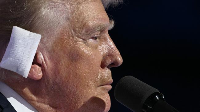 Donald Trump wears a bandage on his ear after he was injured during an assassination attempt. Picture: AFP.