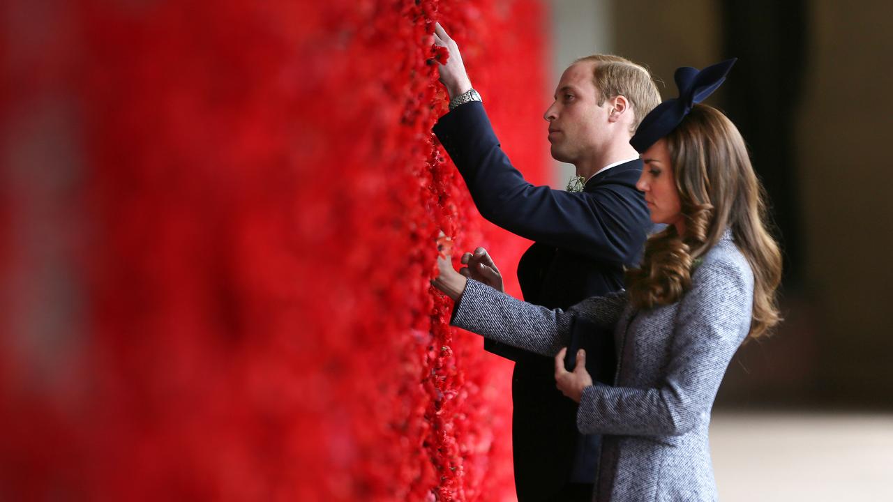 The Duke and Duchess of Cambridge place a poppy into the WWI Wall of Remembrance at the Australian War Memorial, Canberra, on April 25, 2014. Picture: Gary Ramage/Getty Images