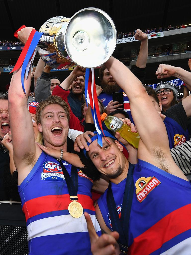 Shane Biggs and Clay Smith celebrate with the trophy after winning the 2016 AFL Grand Final. Picture: Getty Images