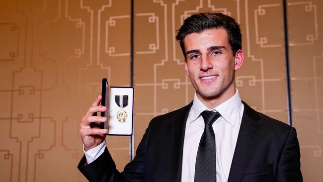 MELBOURNE, AUSTRALIA – OCTOBER 04: Nick Daicos poses for a photo after winning the E.W Copeland Trophy during the Collingwood Magpies Best And Fairest Awards at Crown Palladium on October 04, 2024 in Melbourne, Australia. (Photo by Asanka Ratnayake/AFL Photos/via Getty Images)