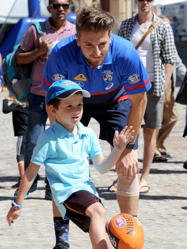 Bontempelli, with his left knee bandaged, at the launch of the 2018 Auskick program. Picture: Andrew Henshaw