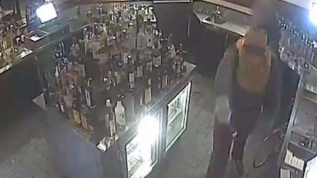 Police have released CCTV of the moment a hotel in Alexandria was robbed at knifepoint last month.
