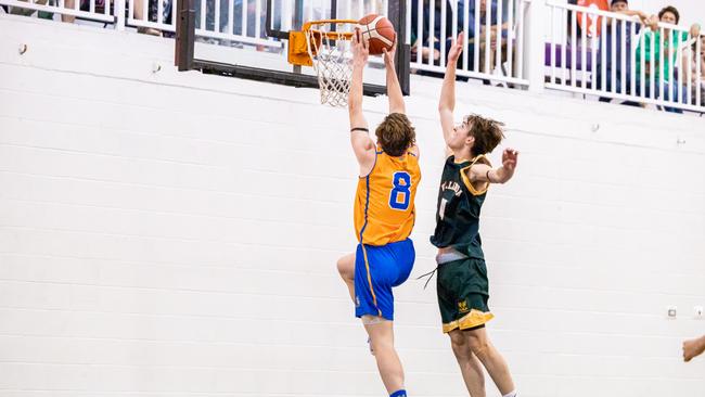 AIC Basketball action: Ashgrove's Jack Forrester throws it down. Picture courtesy of Denver Jensen.