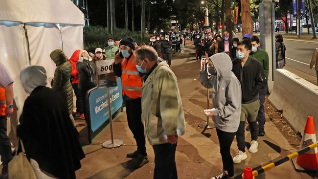 Masked Sydneysiders at the Vaccination Hub at Homebush in the city’s west on Wednesday. Picture: Richard Dobson