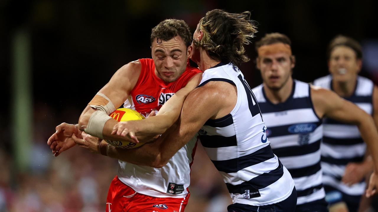 Sydney's Will Hayward tackled by Geelong's Mark Blicavs. Picture: Phil Hillyard