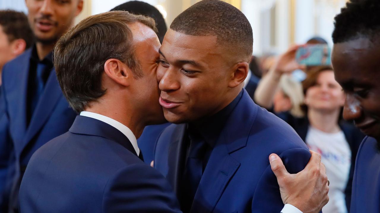 French president Emmanuel Macron embraces PSG superstar Kylian Mbappe