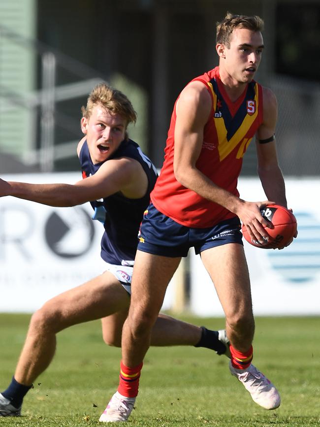 Glenelg’s Luke Edwards evades new Power recruit Miles Bergman in this year’s AFL under-18s championship match between SA and Vic Metro. Picture: Mark Brake (AFL Photos/via Getty Images)