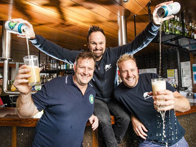 Australian Gold Medalist Steven Bradbury and son's of Rugby Union legend Roy Prosser, Damian (** this is correct spelling on Damian**) check story/ dark hair) and Stephen (blonde) at South Bank Beer Garden. Article is about their new beer, Last Man Standing and how these local sporting legends have received a large amount of public support for their new beer brand.  Picture: NIGEL HALLETT