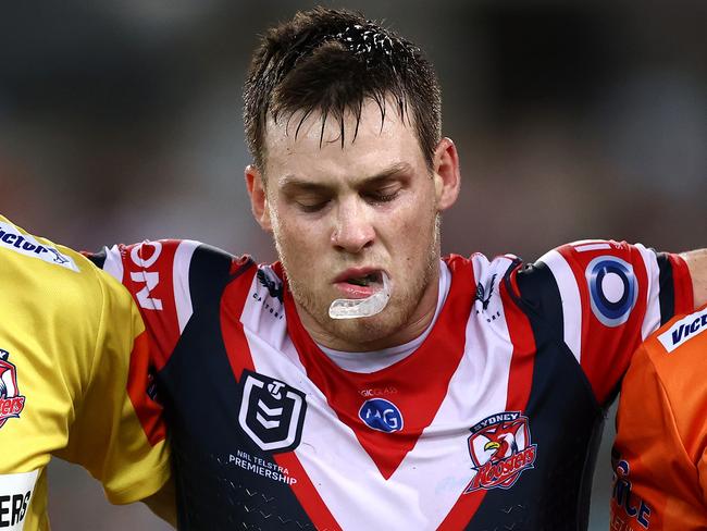 SYDNEY, AUSTRALIA - MARCH 26:  Luke Keary of the Roosters is helped off the field after a leg injury during the round three NRL match between the South Sydney Rabbitohs and the Sydney Roosters at Stadium Australia on March 26, 2021, in Sydney, Australia. (Photo by Cameron Spencer/Getty Images)