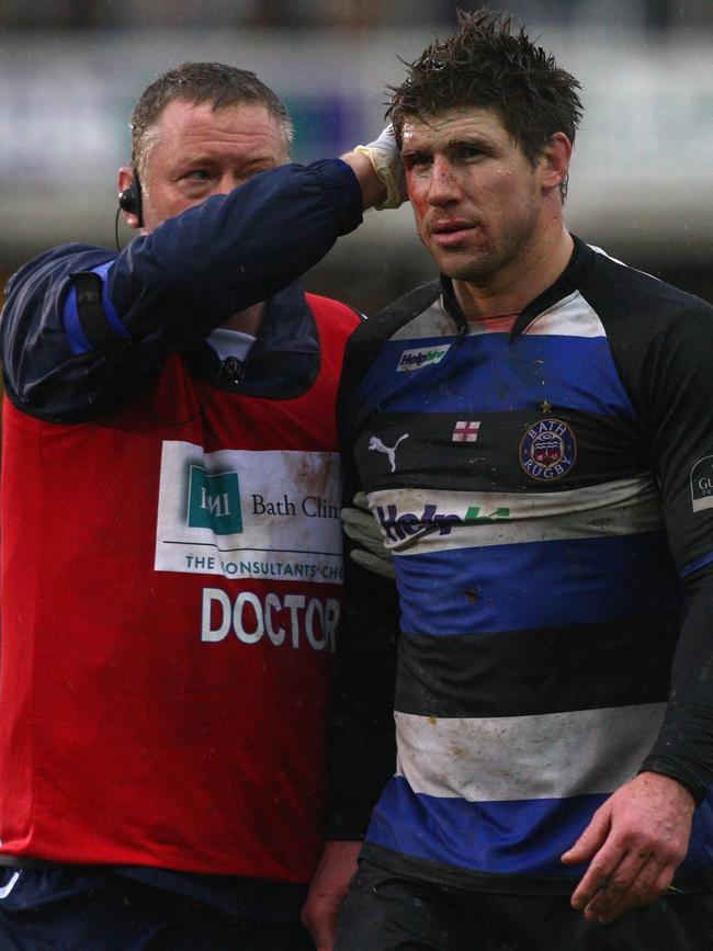 Michael Lipman is treated after a heavy clash in a 2009 match. Picture: Getty Images