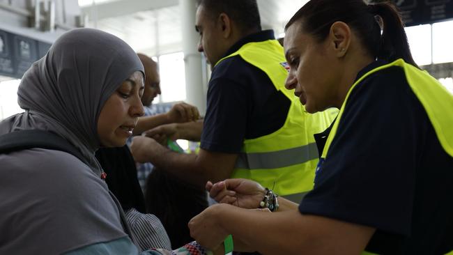 Australian Government officials assisting Australians to depart Lebanon on two government-supported charter flights from Beirut Airport to Larnaca, Cyprus and on to Australia. Picture: NewsWire Handout