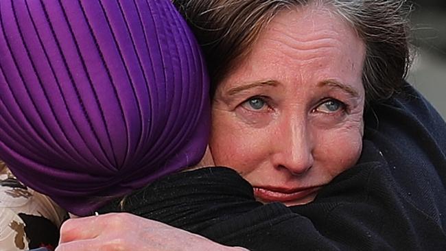 Two women embrace in St Ann's Square during a vigil on May 24, 2017 in Manchester, England — the emotional toll after an explosion at Manchester Arena two days earlier as people left the Ariana Grande concert caused 22 fatalities and injured 59. (Photo by Christopher Furlong/Getty Images)