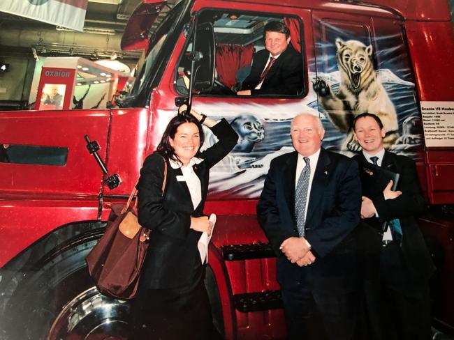 Jackie Taranto and former Minister Rob Schwarten (in truck), with unidentified officials, at Hannover Messe Germany Fair, Germany, in the early 2000s.