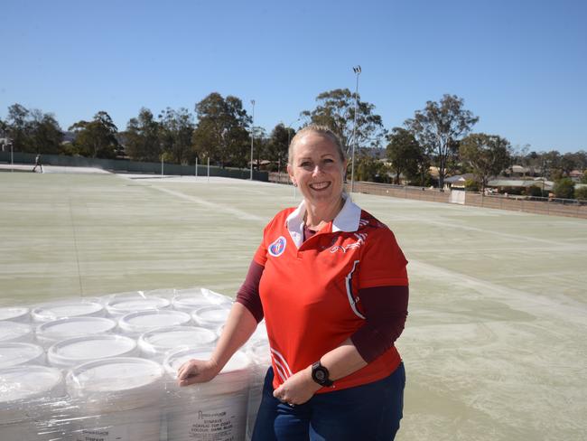 Linda Bunch in front of the new courts being constructed at Warwick Netball Association headquarters at Barnes Park.