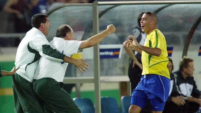 Brazil's Ronaldo runs to celebrate with Brazilian coach Luiz Felipe Scolari.