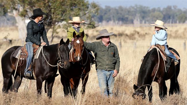 SUNDAY TELEGRAPH SPECIAL. PLEASE CONTACT ST PIC ED JEFF DARMANIN BEFORE PUBLISHING  Droving couple  Bek and Justin Hourigan with daughters Sienna, 5, and Tori, 7, have made the Long Paddock their homein north west NSW. Picture by Peter Lorimer.