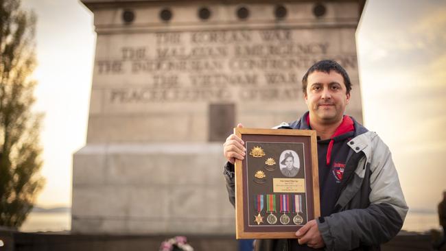 ANZAC Day Dawn Service at the Hobart Cenotaph, Joshua Mione with his great grand fathers medals, Verdan Nathaniel William Paget who was killed in WW2. Picture: Chris Kidd