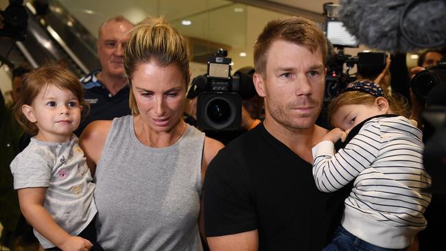 Candice Warner and husband David Warner with their children on their arrival in Australia after the ball tampering scandal broke in South Africa. Picture: AAP