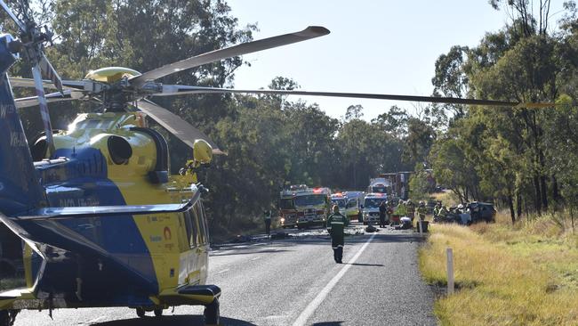 Emergency services attend the scene of a fatal truck and car collision on the Gore Highway at Millmerran Downs.