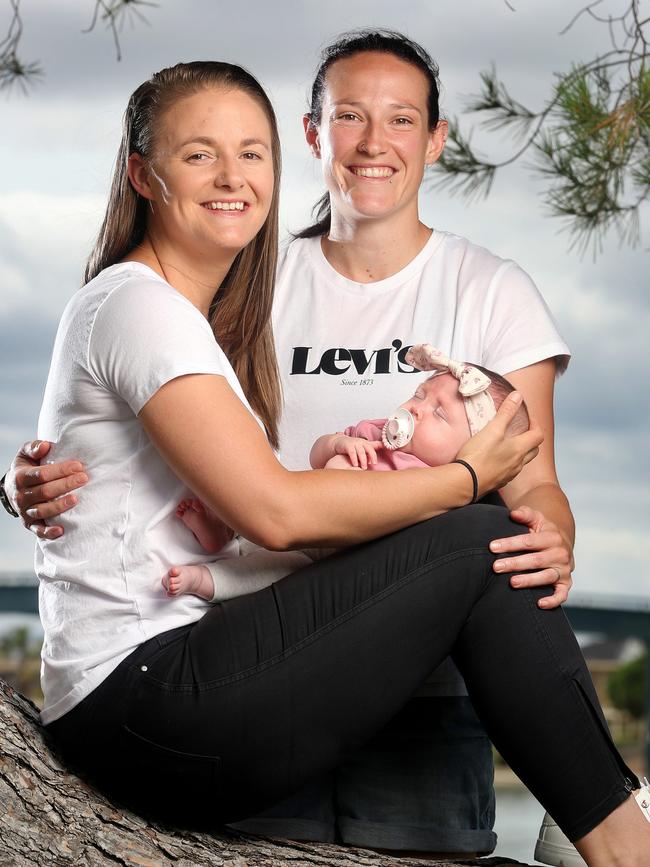 Aussie opening bowler Megan Schutt with wife Jess and five-month-old baby daughter Rylee. Picture: Sarah Reed/Getty Images