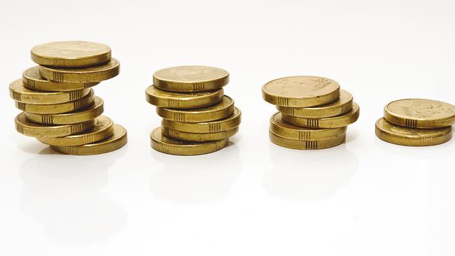 Untidy downward trending "graph" of well used Australian two dollar coins on a white background.