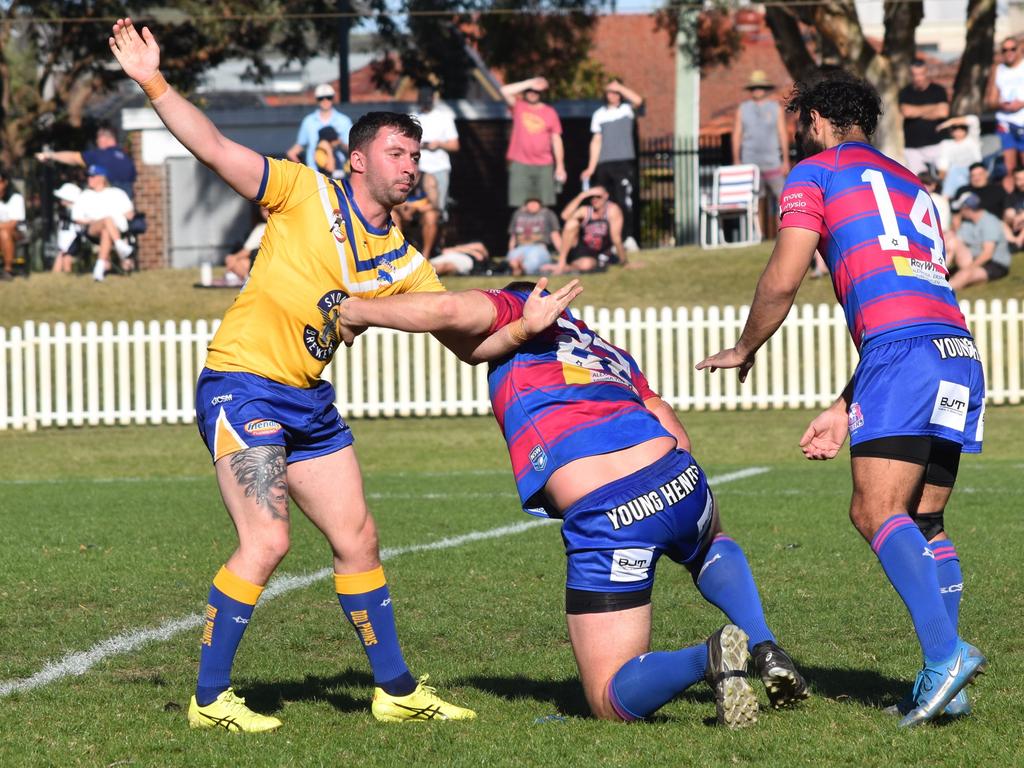 Dolphins player James Barran gets tangled up with Riley Lord. Picture: Sean Teuma