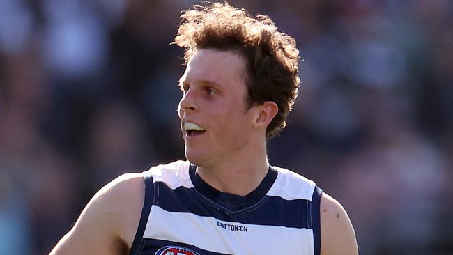 GEELONG, AUSTRALIA - AUGUST 24: Max Holmes of the Cats reacts during the round 24 AFL match between Geelong Cats and West Coast Eagles at GMHBA Stadium, on August 24, 2024, in Geelong, Australia. (Photo by Kelly Defina/Getty Images)