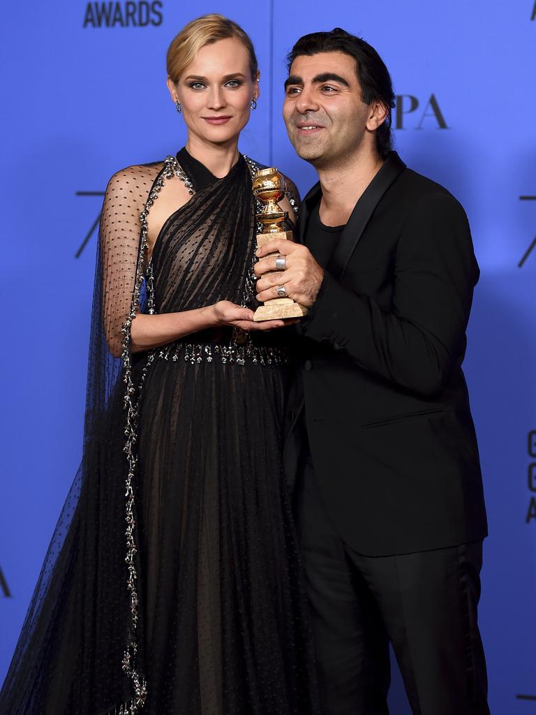 Diane Kruger and Fatih Akin poses in the press room with the award for best motion picture - foreign language for “In The Fade” at the 75th annual Golden Globe Awards. Picture: AP