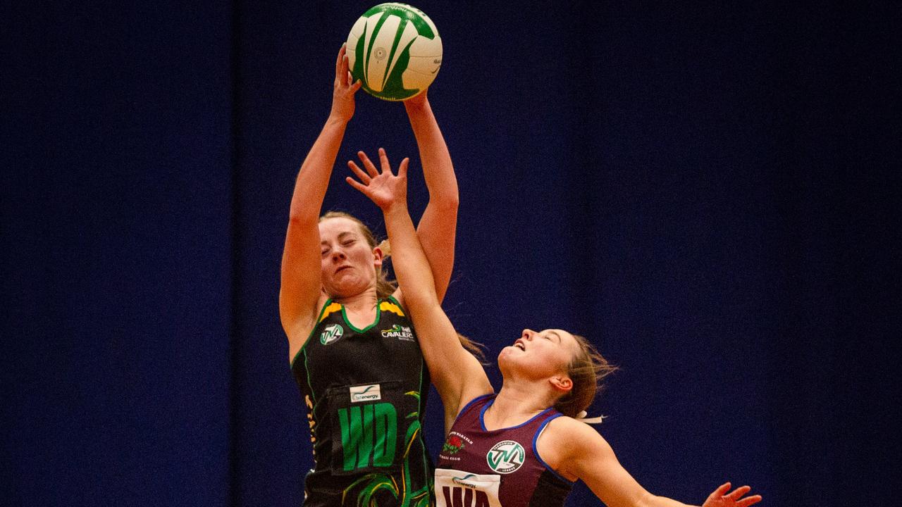 Cavaliers wing defence Asha Lowe and Cripps wing attack Maya Armstrong clash in the air in the U19 state netball grand final at Launceston's Silverdome. Picture: PATRICK GEE/SUPPLIED