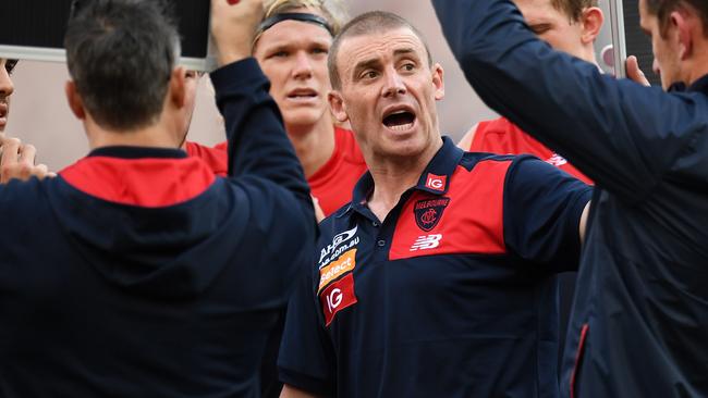 Melbourne Coach Simon Goodwin addresses his team during their clash with North Melbourne. Picture: Julian Smith