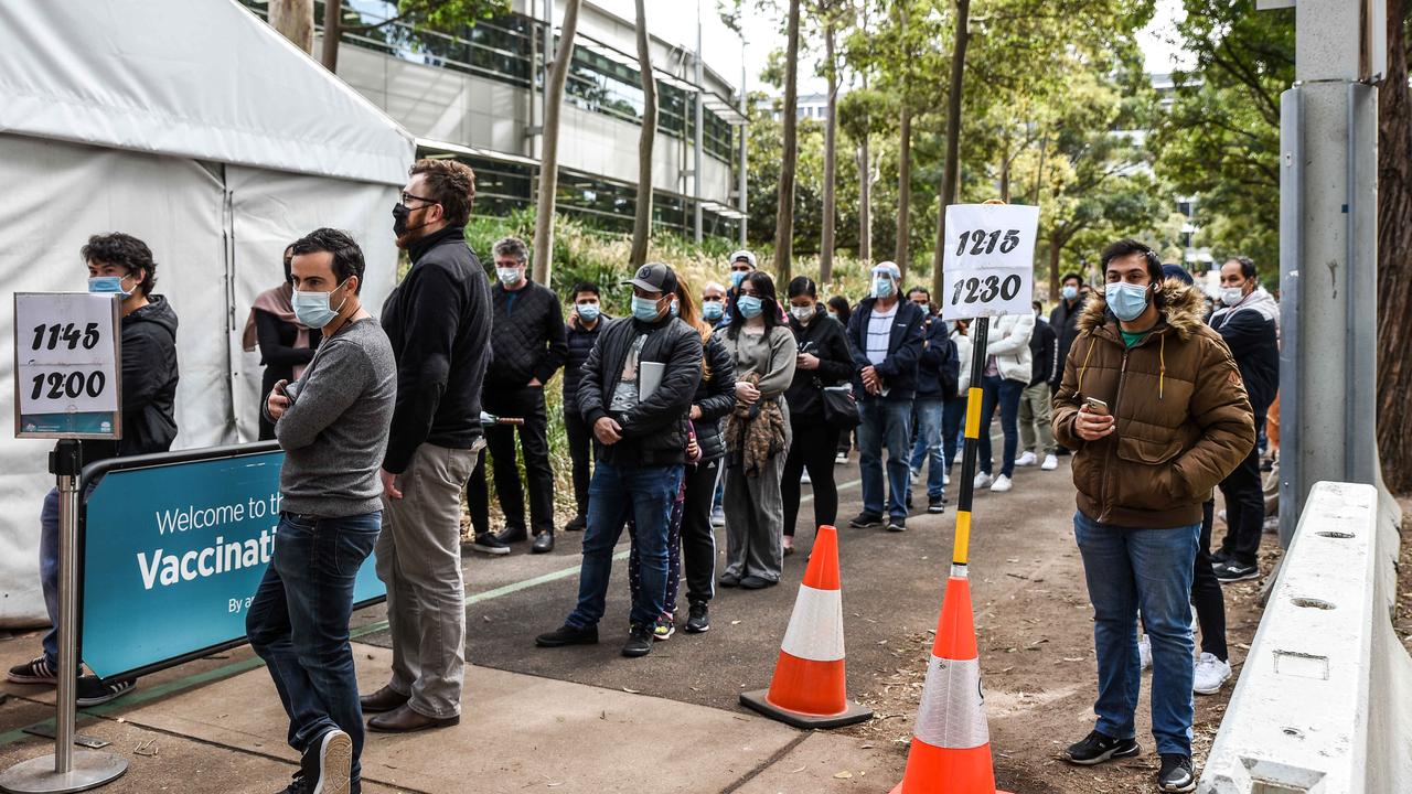 Sydneysiders queue to receive their vaccination at the NSW Vaccine Centre at Homebush Olympic Park in Sydney. Picture: NCA NewsWire / Flavio Brancaleone