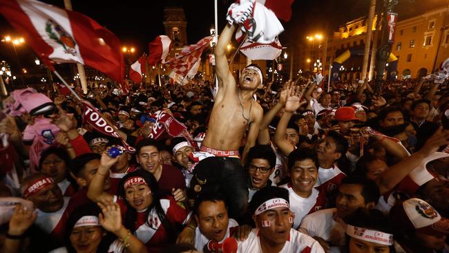 Supporters of Peru celebrate.
