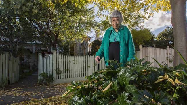 Gwen McWilliam and the “offending” plants on the nature strip. Picture: Valeriu Campan