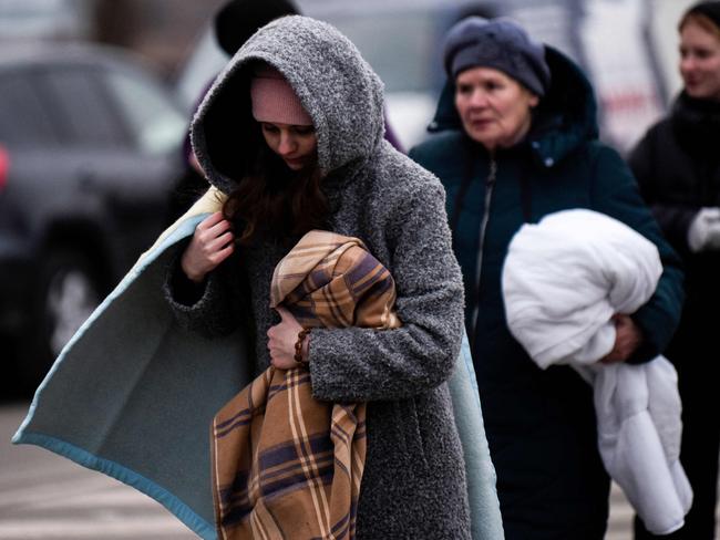 Ukrainian evacuees walk at the Ukrainian-Romanian border in Siret, northern Romania. More than three million people have fled Ukraine since the start of the invasion, Picture: AFP