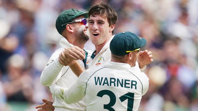 Pat Cummins of Australia (centre) celebrates a wicket with Nathan Lyon and David Warner of Australia on day 3 of the Boxing Day Test match between Australia and New Zealand at the MCG in Melbourne, Saturday, December 28, 2019. (AAP Image/Michael Dodge) NO ARCHIVING, EDITORIAL USE ONLY, IMAGES TO BE USED FOR NEWS REPORTING PURPOSES ONLY, NO COMMERCIAL USE WHATSOEVER, NO USE IN BOOKS WITHOUT PRIOR WRITTEN CONSENT FROM AAP